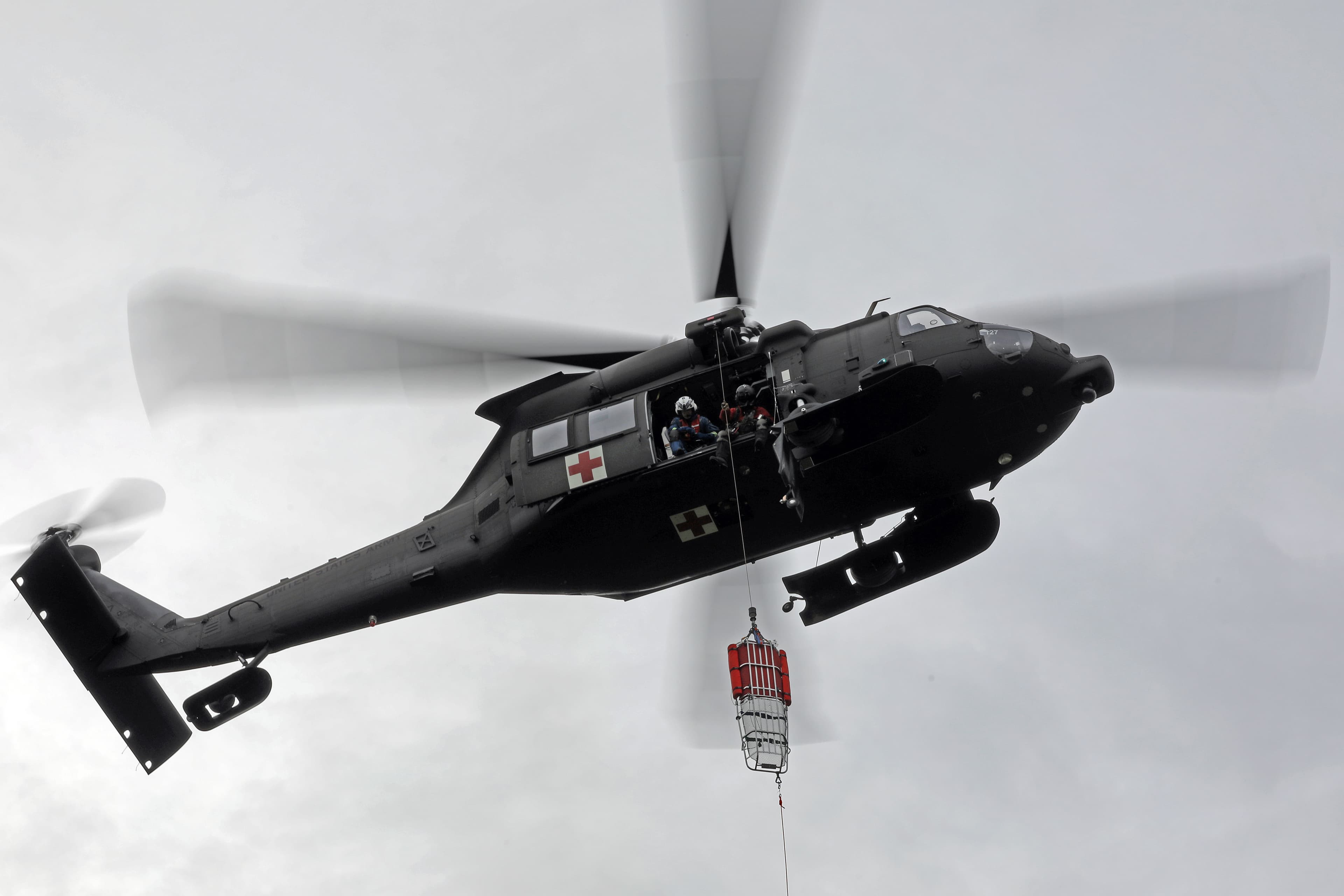 Dynamic hoist training exercise with helicopter crew