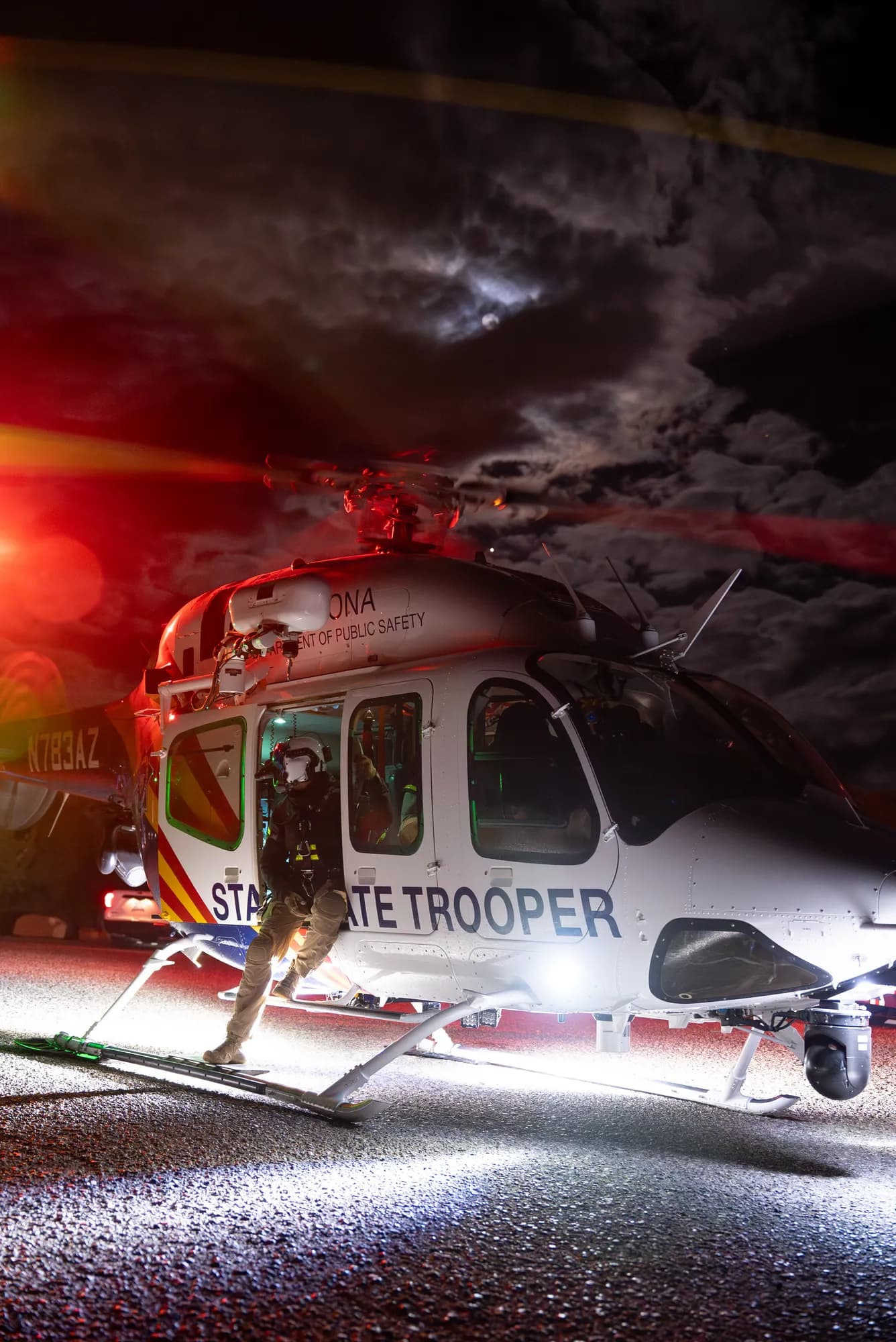 Arizona DPS AW139 State Trooper helicopter at night with crew boarding